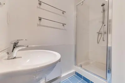 a white bathroom with a sink and a shower at 2 Bed in Porthleven oc-p00890 in Porthleven