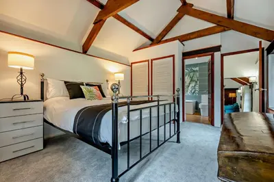 a bedroom with a large bed and a window at 1 Bed in Advent oc-b29387 in Camelford