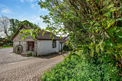 a small stone house with a brick driveway at 1 Bed in Advent oc-b29387 in Camelford
