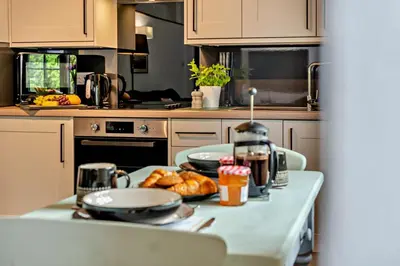 a kitchen with a table with food on it at 1 Bed in Advent oc-b29387 in Camelford
