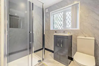 a bathroom with a shower and a toilet and a sink at 2 Bed in Advent oc-p6188 in Camelford