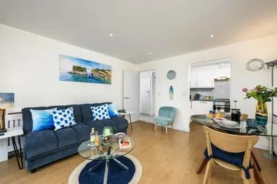 a living room with a couch and a table at 32 Tre Lowen in Newquay