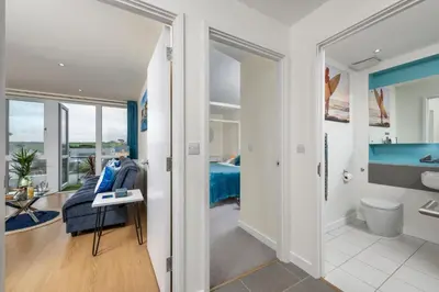 a bedroom with a view of a bathroom at 32 Tre Lowen in Newquay