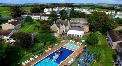 an aerial view of a house with a swimming pool at Atlantic Reach – Cozy 2-Bed with Parking in Newquay