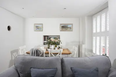 a living room with a couch and a table at 4 Quayside - Centre of Fowey - Pet Allowed - Free WiFi in Fowey