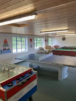 a room with two ping pong tables in it at Myrtle Grove in Saint Endellion