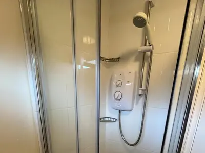 a shower with a shower head in a bathroom at Stanbury in Padstow
