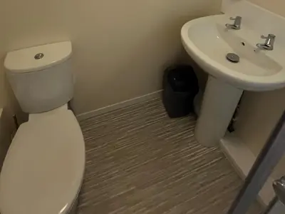 a bathroom with a toilet and a sink at Stanbury in Padstow