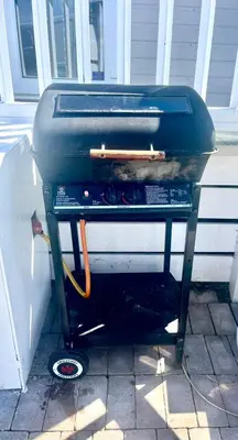 a grill sitting on top of a porch at Holiday Home with Hot Tub Cornish Country SeaSide in Porth