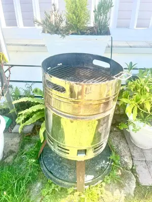 a bucket sitting on a stand in a garden at Holiday Home with Hot Tub Cornish Country SeaSide in Porth