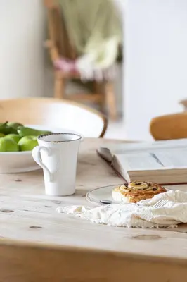 a table with a plate of food and a cup of coffee at Rose Cottage in Port Isaac