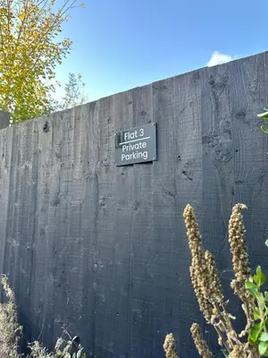 a sign on a wall that says licks bridge batting at Ye Old Mill - Stylish cosy retreat with parking in Penryn