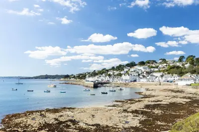 a view of a beach with boats in the water at Mariners Cottage in Saint Mawes