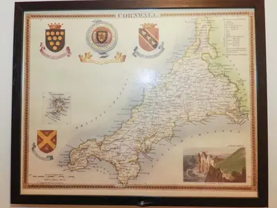 a framed map of britain with insignias at Yonja Homes in St Austell