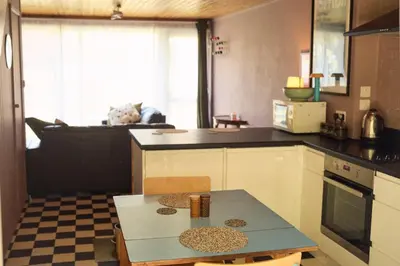 a kitchen with a table and a counter top at Little Pol in Saint Columb Road Station