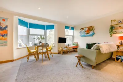 a living room with a couch and a table at 1 Bed in Newquay oc-o33805 in Newquay