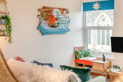 a living room with a couch and a window at 1 Bed in Newquay oc-o33805 in Newquay