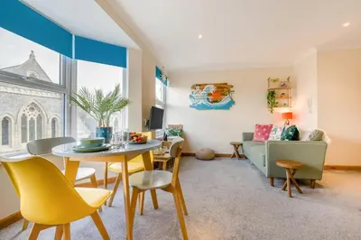 a living room with a table and chairs and a couch at 1 Bed in Newquay oc-o33805 in Newquay