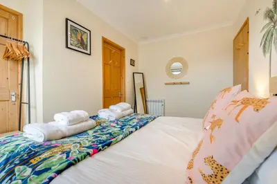 a bedroom with a bed with towels on it at 1 Bed in Newquay oc-o33805 in Newquay