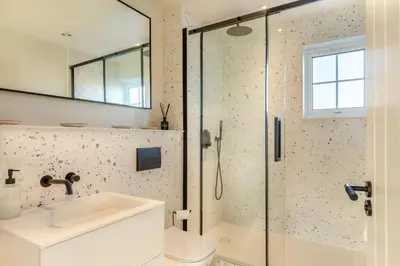 a bathroom with a shower and a sink at 2 Bed in Trevarrian oc-c33855 in Mawgan Porth