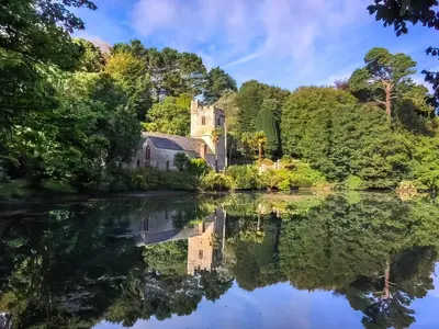 a house reflected in the water of a river at Shearwaters in Truro