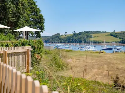 a view of a marina with boats in the water at Cellars Cottage in Porthscatho