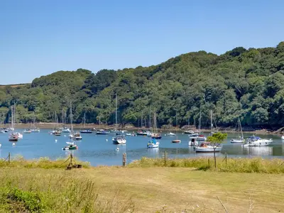a bunch of boats are docked in a harbor at Cellars Cottage in Porthscatho