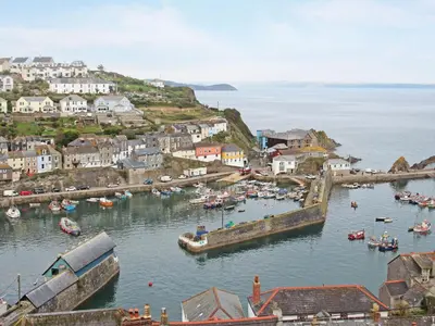 a group of boats in the water in a harbor at Barn 5 in St Austell