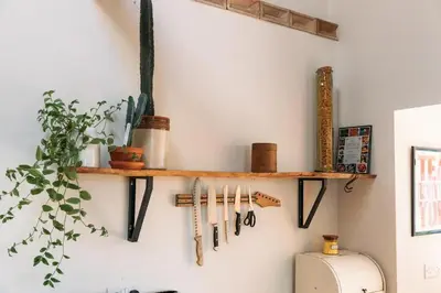 a shelf on a wall with tools on it at 'Langton' - Best Views in Falmouth! in Falmouth