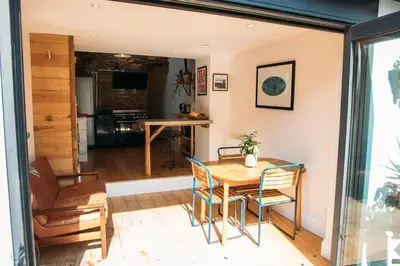 a dining room with a table and chairs at 'Langton' - Best Views in Falmouth! in Falmouth