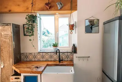 a kitchen with a sink and a window at 'Langton' - Best Views in Falmouth! in Falmouth