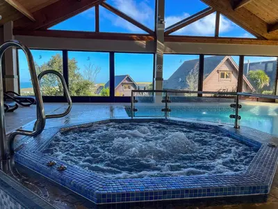 a large jacuzzi tub in a house with water at Adelaide in Redruth