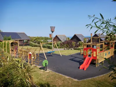 a park with a playground with a swing at Adelaide in Redruth