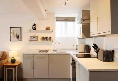 a kitchen with a sink and a counter top at Minutes from the beach and town! in Falmouth