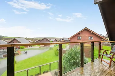 a balcony with a view of a river at 4 Bed in Winnards Perch oc-w34023 in Saint Columb Major