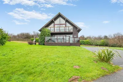 a house with a green lawn in front of it at 4 Bed in Winnards Perch oc-w34023 in Saint Columb Major