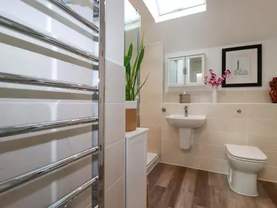 a bathroom with a toilet and a sink at 33 Fordh Tobmen in St. Agnes