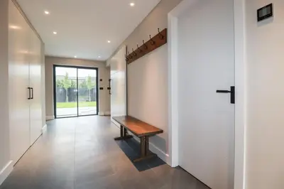 a hallway with a bench in a house at Harberton in Wadebridge