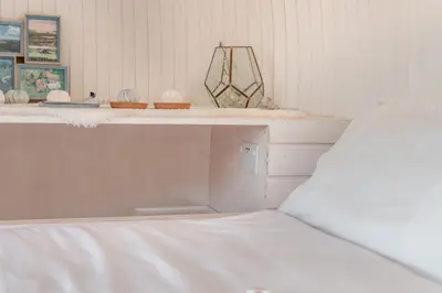 a bedroom with a white bed and a white counter at 1 Bed in Widegates oc-c34232 in Sheviock