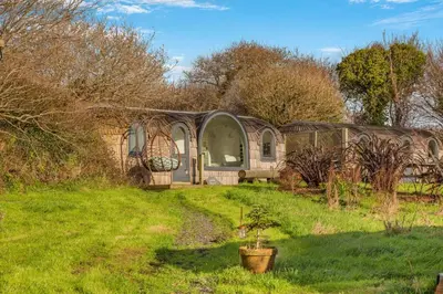 a building in a field with a potted plant in the yard at 1 Bed in Widegates oc-j34234 in Sheviock