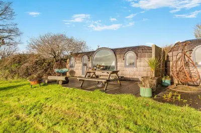 a backyard with a picnic table and a house at 1 Bed in Widegates oc-j34234 in Sheviock
