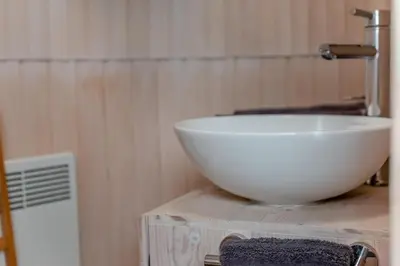a bathroom with a white bowl sink on a table at 1 Bed in Widegates oc-p34233 in Sheviock