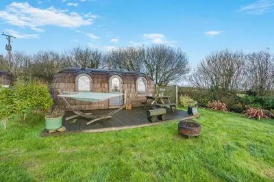 a yurt with a deck in a yard at 1 Bed in Widegates oc-p34233 in Sheviock