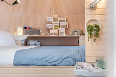 a bedroom with a bed with a wooden wall at 1 Bed in Widegates oc-p34236 in Sheviock