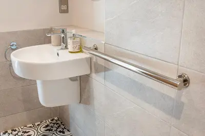 a bathroom with a sink and a toilet at Lowenna at Cusgarne Manor, rural, accessible in Cusgarne