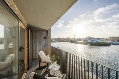 a balcony with a view of the water at 10 Cannery Row - Stunning Views - Pet Welcome - Free WiFi & Parking in Hayle