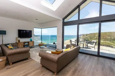 a living room with a view of the ocean at Ocean Skies in Porthtowan