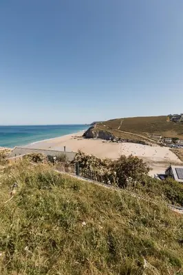 a view of a beach and the ocean at Ocean Skies in Porthtowan