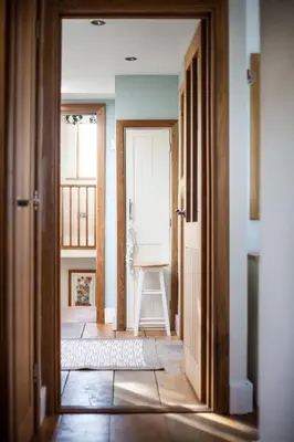 an open door to a room with a chair at Oceans Edge in Portreath