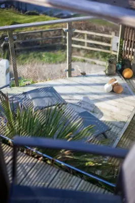 a view of a patio with a fence at Oceans Edge in Portreath